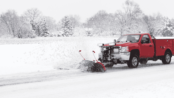  Snow plowing services in Guilderland, NY — Frosty Snow Management plow truck clearing driveways, lots, and roads during a winter storm.